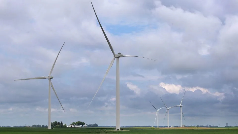 Power generating wind turbines tower over the rural landscape in July 2025 near Pomeroy, Iowa. (Photo by Scott Olson/Getty Images) - Scott Olson/Getty Images