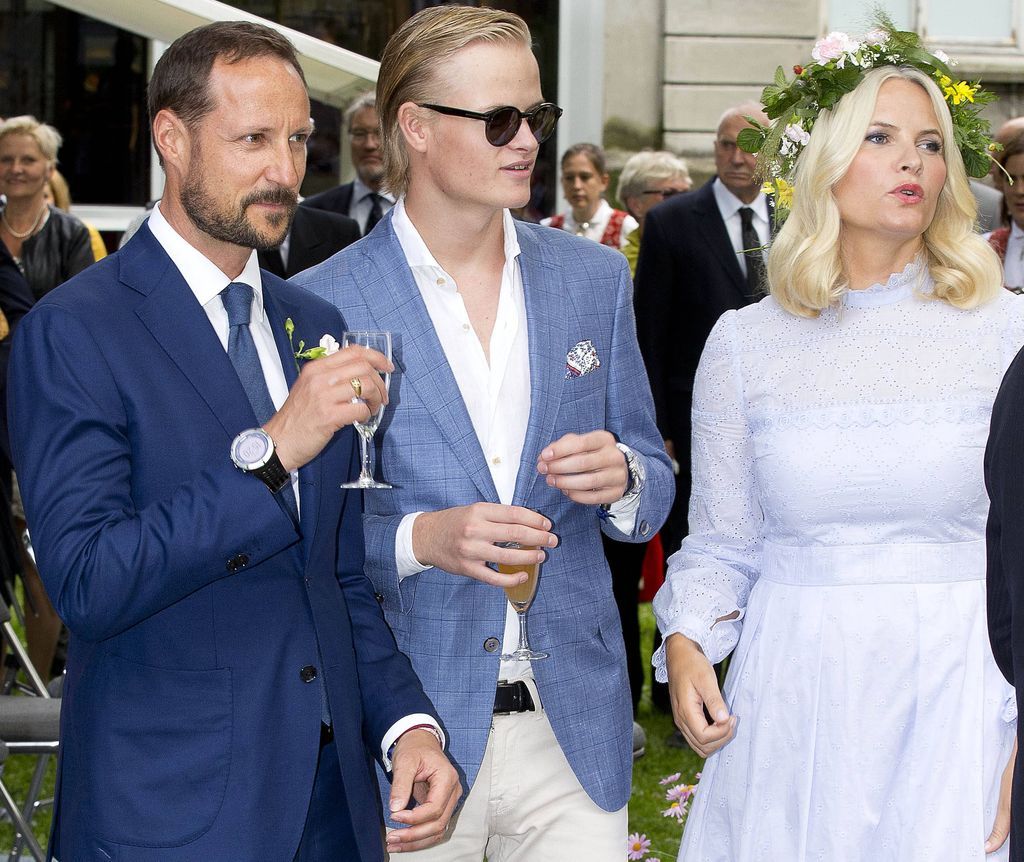 Haakon of Norway with Mette-Marit and Marius at an event in August 2024