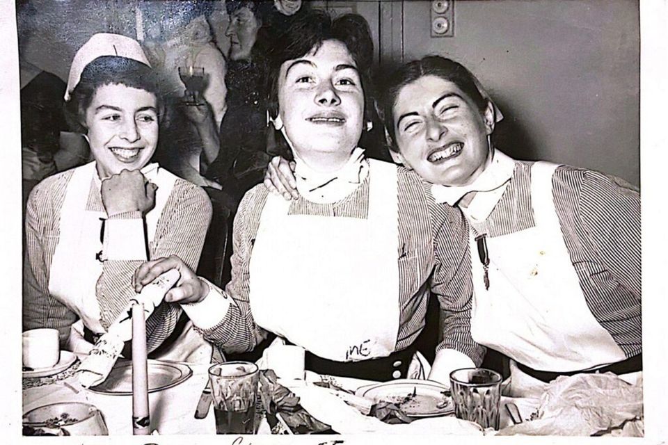 The late Mary Hazard (centre), pictured with nursing colleagues in London, was one of many women who went to work for the NHS. Photo: RTÉ