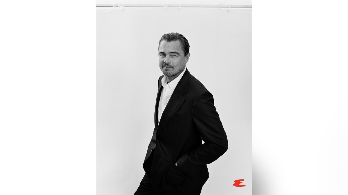 Leonardo DiCaprio poses in black-and-white photo.