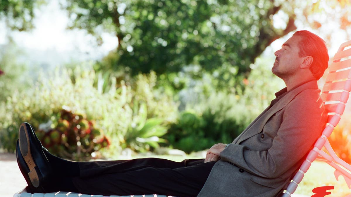 Leonardo DiCaprio sits on lawn chair