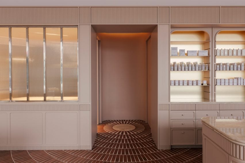 Concentric terracotta-hued floor tiles converge in a doorway