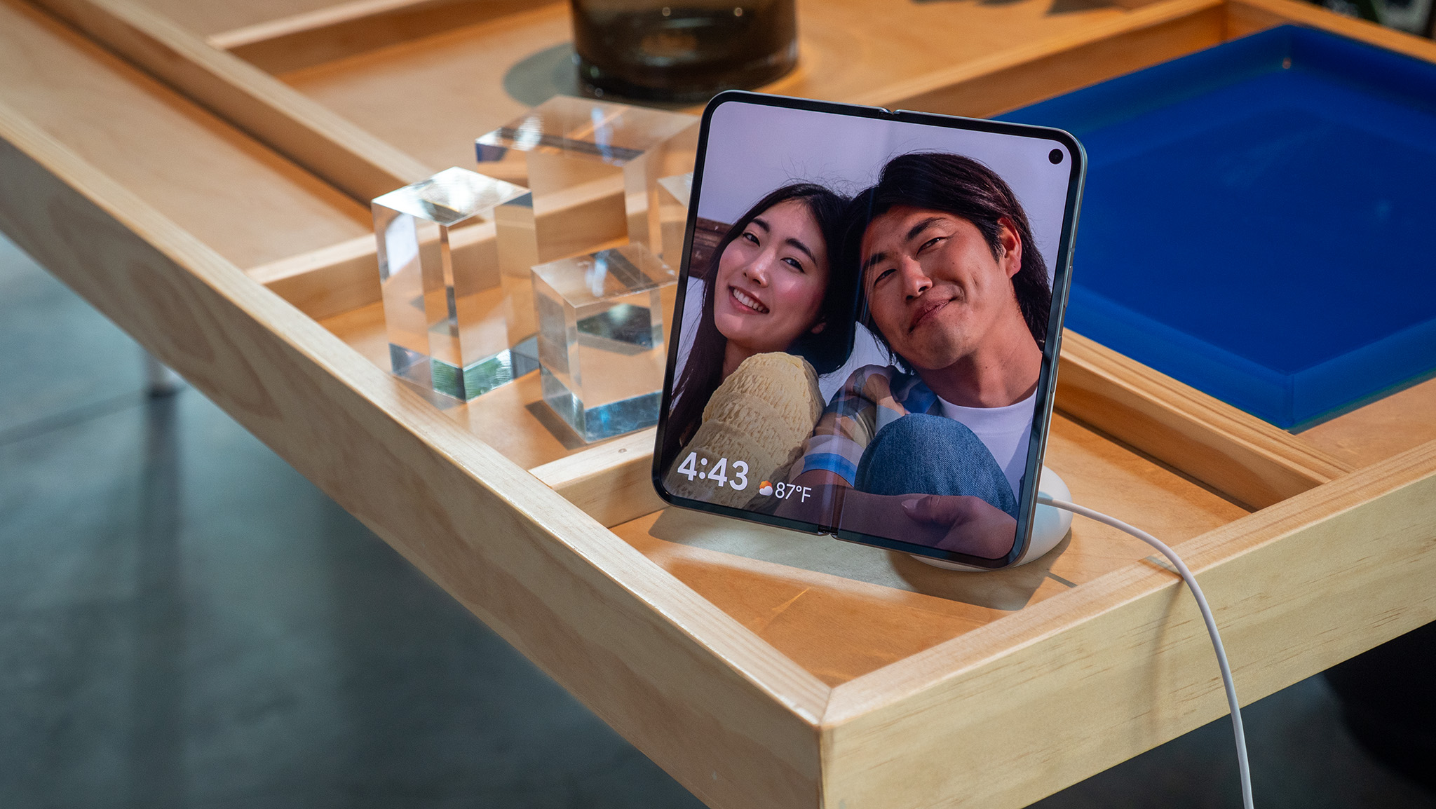 The Google Photos screensaver functionality on a Google Pixel 10 Pro Fold when docked to a Pixelsnap Charger