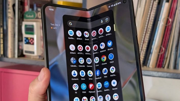 Holding an unfolded Pixel 9 Pro Fold.