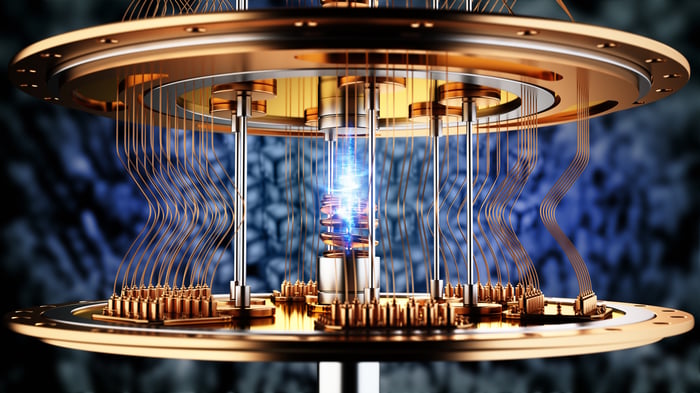 A digital rendering of a futuristic quantum computer with gold-colored circuitry. 