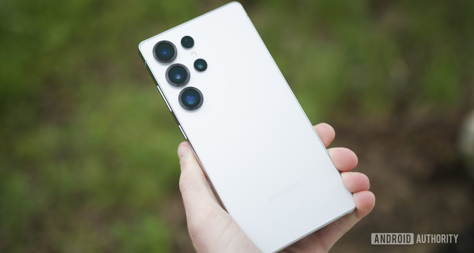 Someone holding the Samsung Galaxy S25 Ultra, showing the back of the phone.