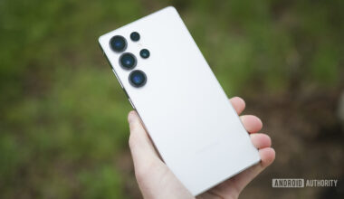 Someone holding the Samsung Galaxy S25 Ultra, showing the back of the phone.