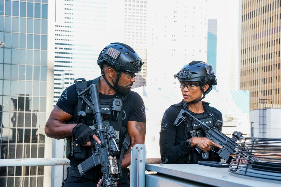 Shemar Moore, Annie Iionzeh, SWAT, season 8 two armed police officers in tactical gear on a rooftop