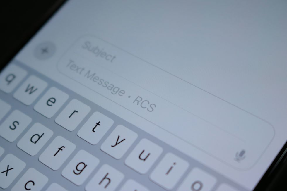 text message shown on-screen with the keyboard below