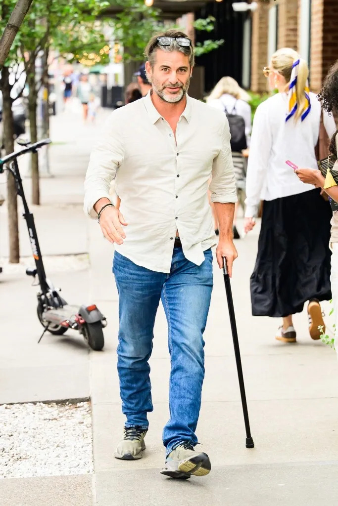The hypnotist has been seen walking with the assistance of a cane on some of his other outings. BACKGRID