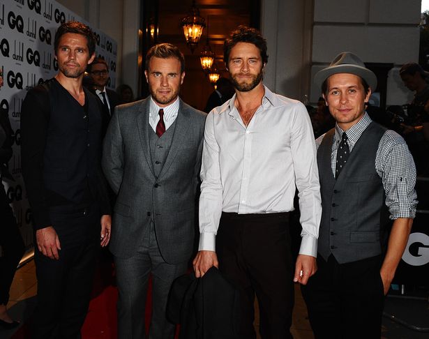 Jason Orange, Gary Barlow, Howard Donald and Mark Owen on a red carpet in 2009.