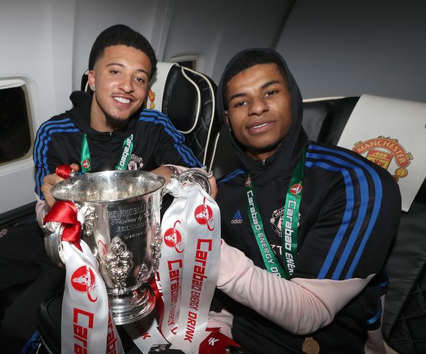 Jadon Sancho, Marcus Rashford of Manchester United celebrates on the plane after the Carabao Cup Final match between Manchester United and Newcastle United at Wembley Stadium on February 26, 2023 in London, England. 
