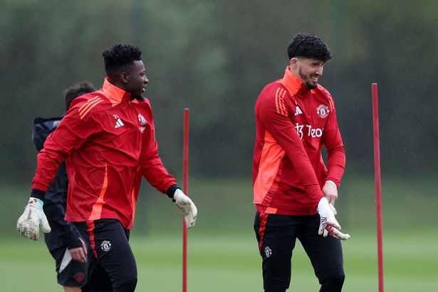 Altay Bayindir (R) and Andre Onana of Manchester United walk out for a training session ahead of their UEFA Europa League 2024/25 quarter final second leg match against Olympique Lyonnais at Carrington Training Ground on April 16, 2025 in Manchester, England. 
