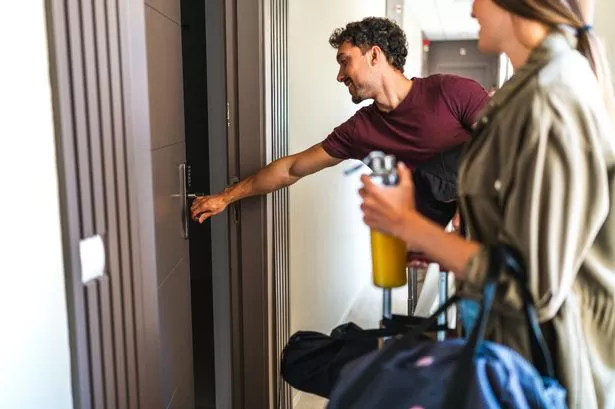 Young couple arriving at room