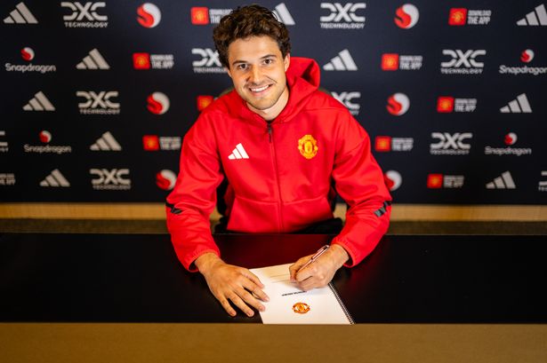 Senne Lammens of Manchester United poses after signing for the club at Carrington Training Ground on September 01, 2025 in Manchester, England.