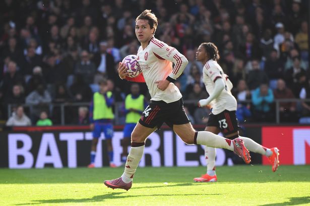 Federico Chiesa of Liverpool runs back with the ball after scoring