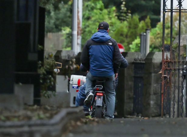 24/09/'25 Derek 'Delboy' Hutch, brother of murder victim Gary Hutch, leaving Glasnevin Cemetery as a pillion passenger on an electric bicycle after visiting Gary's grave on the 10th anniversary of his death in Spain