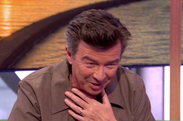 Rick Astley battled a coughing fit throughout his interview