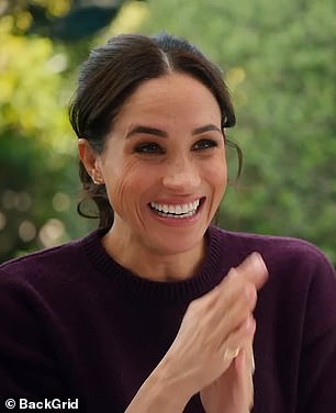 Meghan wearing her burgundy Sezane Jumper in new Netflix series