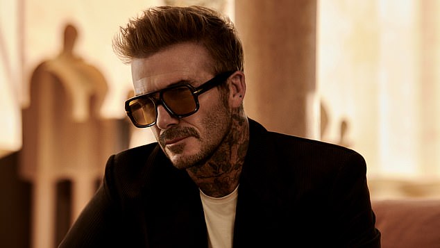 David wore a suit jacket with a white tee underneath in another sizzling shot