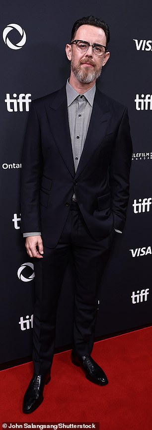 He sported a bushy salt-and-pepper beard and looked rail thin
