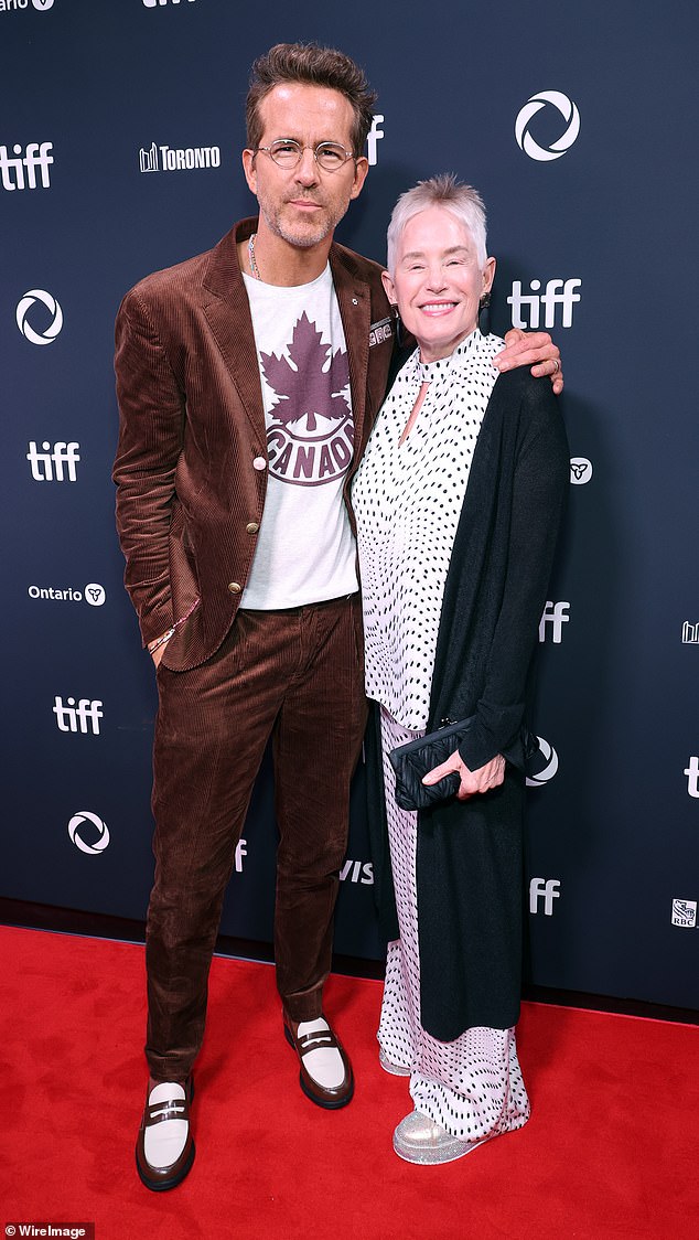 Ryan was joined by his mother Tammy Reynolds. He wore a casual but stylish corduroy suit with a classic Canada T-shirt and brown-and-white loafers