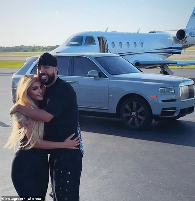 The couple were pictured holding each other in front of a Rolls Royce and a private jet during their Orlando trip