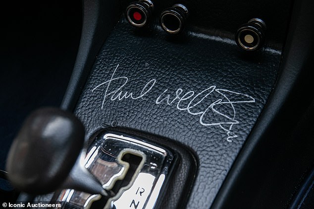 It is during this meet that the singer scribed his autograph onto the plastic centre console panel for ultimate authentication