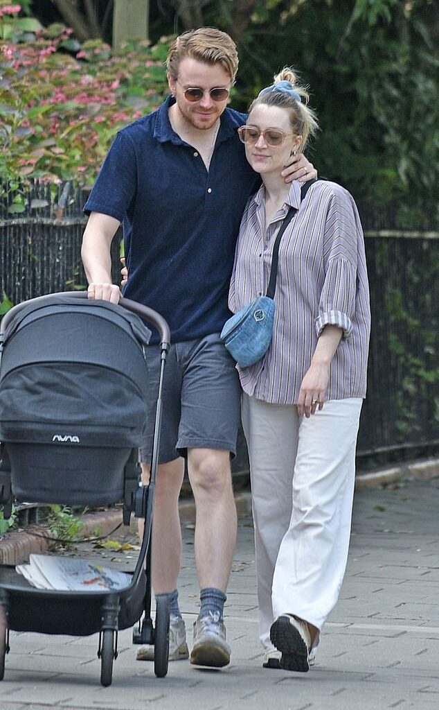 Jack Lowden and his wife Saoirse Ronan looked utterly smitten as they took their new baby out in its pram on Tuesday