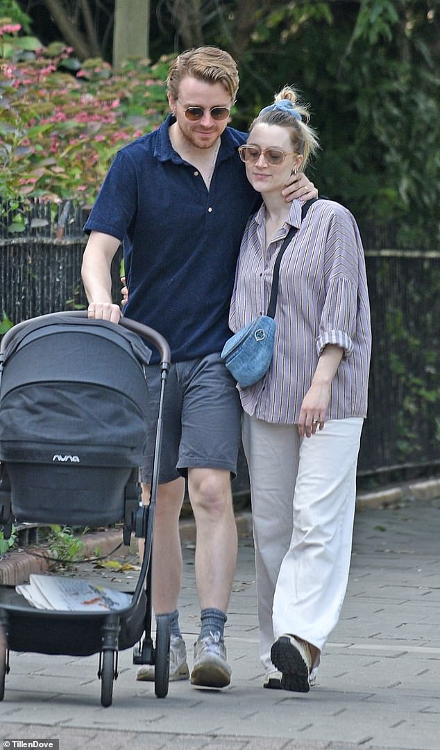 Jack Lowden and his wife Saoirse Ronan looked utterly smitten as they took their new baby out in its pram on Tuesday