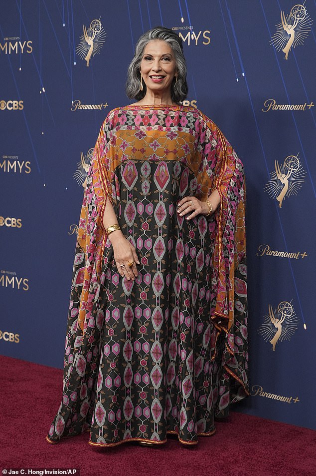 Gilmore Girls star Rose Abdoo, 62, was largely swamped by her choice of gown - she was left completely covered by the geometric patterned dress in hues of green, orange and pink that draped to the floor with batwing style sleeves