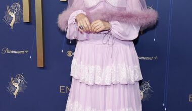 Renowned actress Parker Posey, 56, who most recently appeared in The White Lotus, arrived in an old fashioned frilly, tiered lilac gown that featured long sleeves and a sheer mini cape with a fur hem