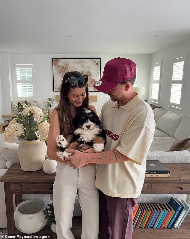 In June, Conor revealed he and Kitty had adopted a Bernedoodle puppy named Bernard as he posted a picture of the couple cuddling the pooch