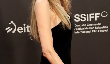 Angelina Jolie, 50, turned heads in a black plunging gown as she posed on the red carpet during the Couture photocall at the San Sebastian Film Festival in Spain on Sunday