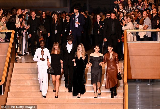 Angelina linked arms with pals as she exited the theatre; pictured L-R Anyier Anei, French director Alice Winocour, French actor Louis Garrel, Angelina, Swiss actress Ella Rumpf and French actress Garance Marillier