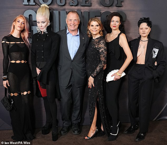 Lady Mary Charteris, Daphne Guinness, Lord Ned Iveagh, Ivana Lowell, Jasmine Guinness and Celeste Guinness put on an eccentric group display as they posed at the House of Guinness premiere (pictured L-R)