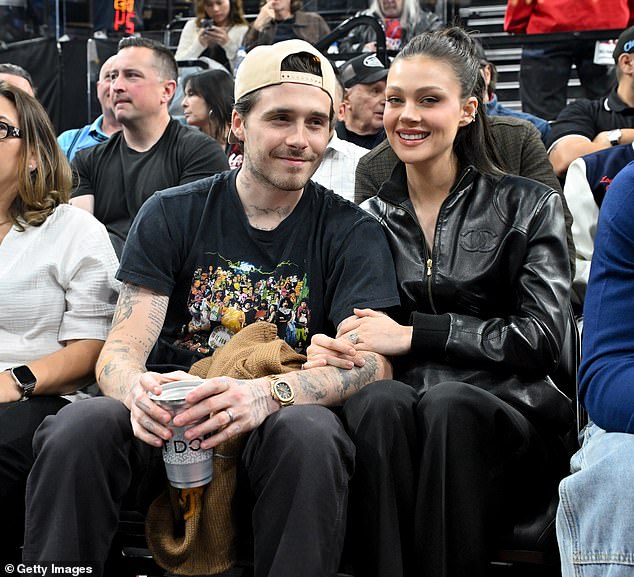 'I have a very supportive wife... and we're happy,' Brooklyn said of Nicola Peltz (right)
