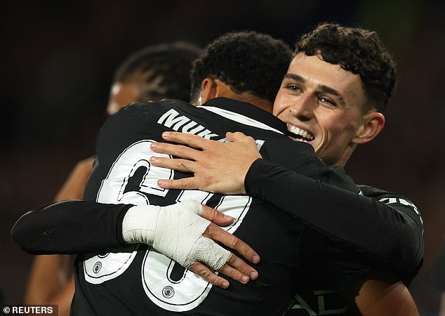 Phil Foden scored a fine opening Manchester City goal as they beat Huddersfield 2-0