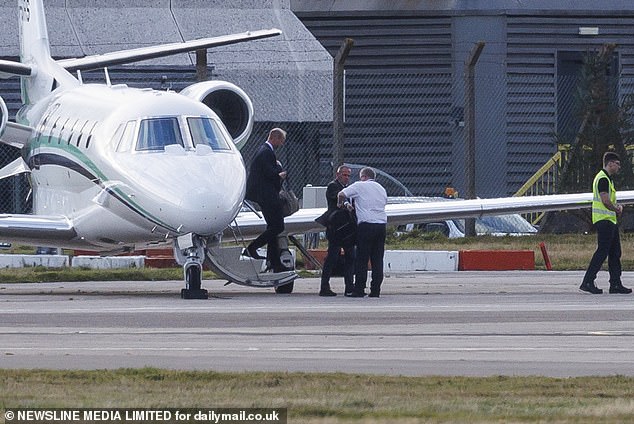 Prince William steps off a private jet at Aberdeen Airport after landing on Tuesday afternoon