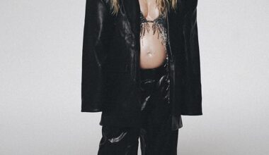 Pregnant Perrie Edwards wowed in a racy bralette as she showed off her blossoming bump and released her debut solo album on Friday - the same day Jesy Nelson announces engagement