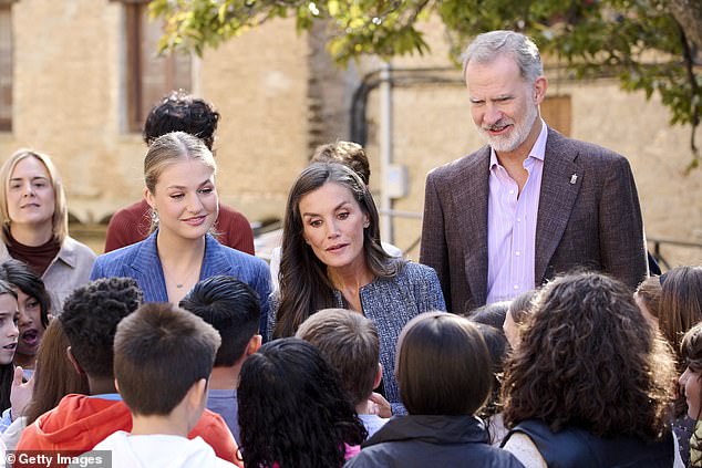 During the second day of the two-day trip, the royals were snapped greeting members of the public who'd come out to see them (pictured L-R: Princess Leonor; Queen Letizia; King Felipe)