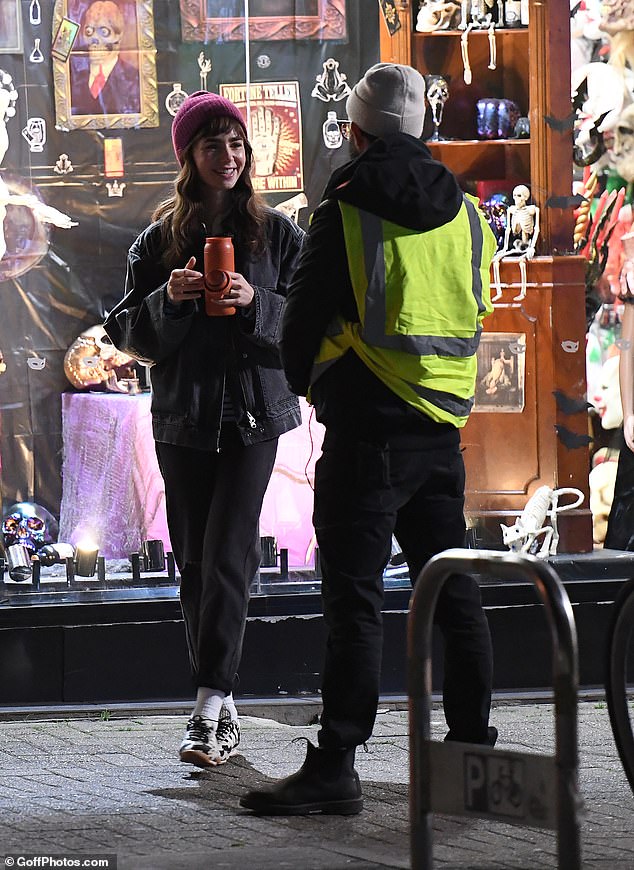 Lily was spotted chatting to the film crew in between takes as she held an orange bottle