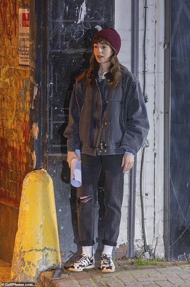 The actress shielded from the cold with her beanie hat and t-shirt beneath her thick denim jacket