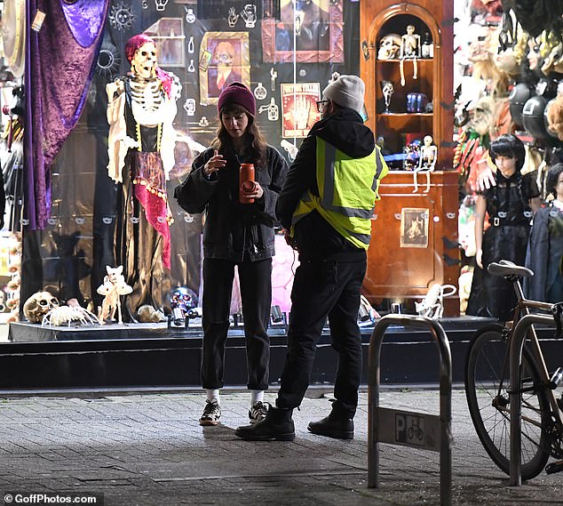 The actress stopped for a chat with a member of staff wearing a hi-vis jacket outside the fancy dress shop near to where the scene was filmed