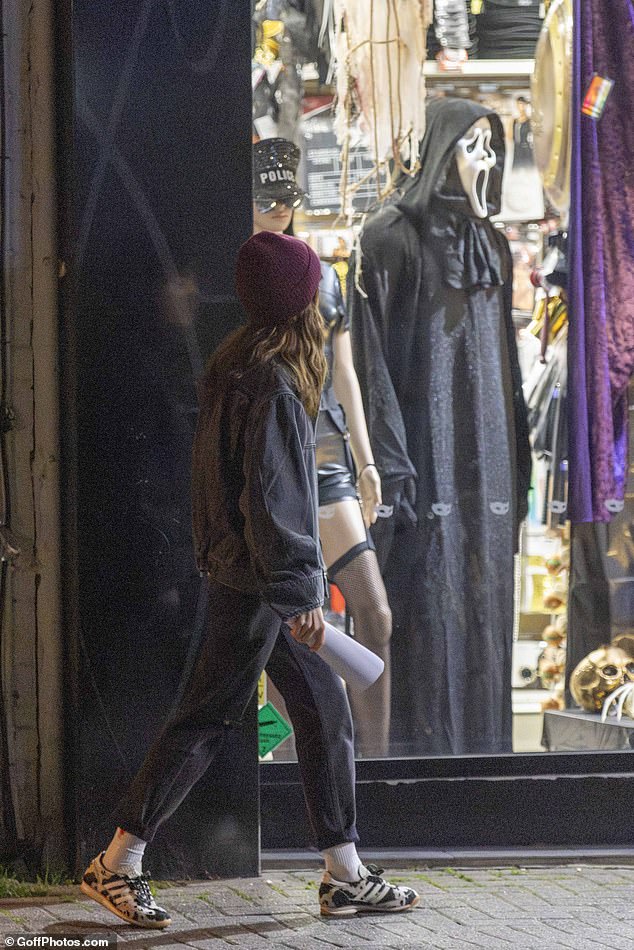 Lily's attention appeared to be drawn to some of the spooky costumes at the fancy dress shop