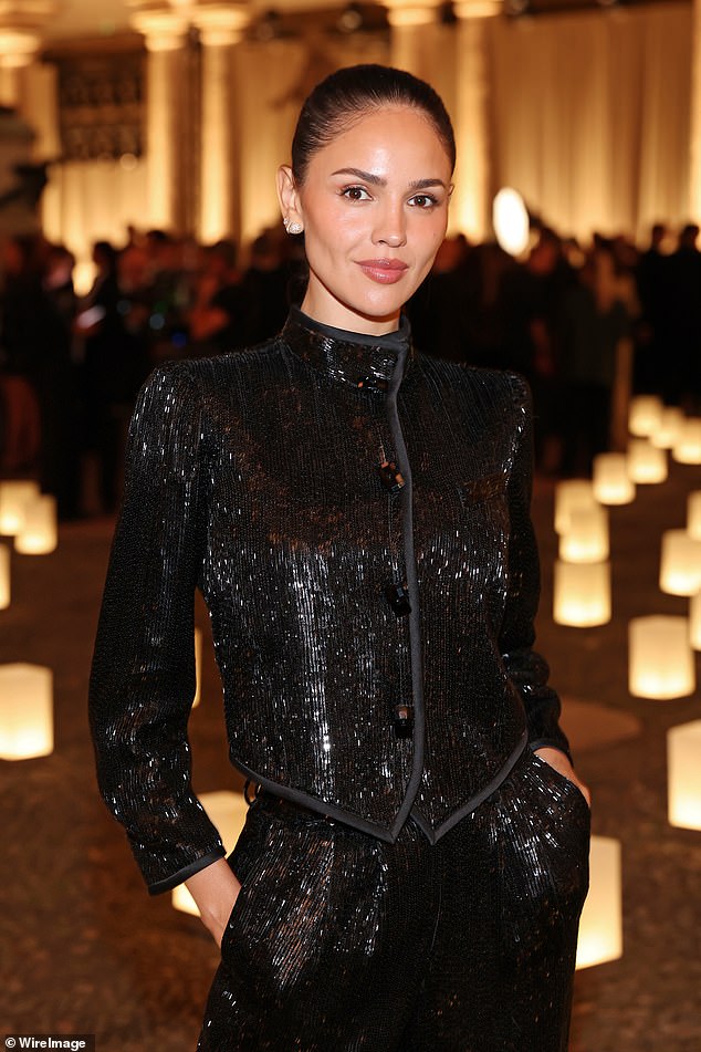 Eiza has her hair pulled back into a sleek bun and opted for a very subtle makeup look