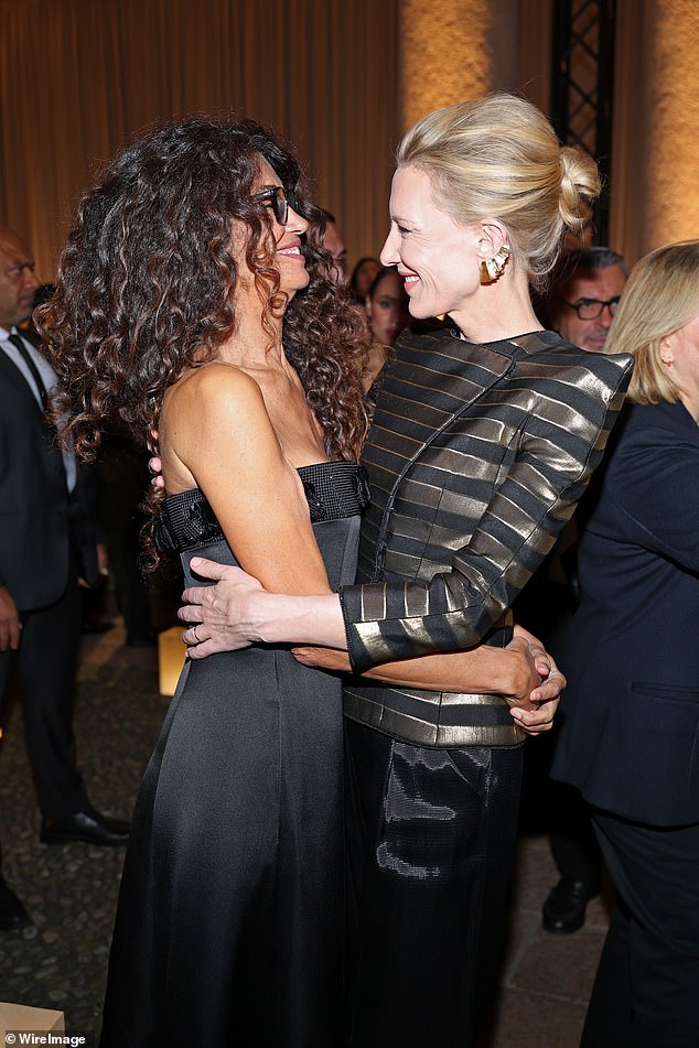 The duo shared a hug as the event got underway