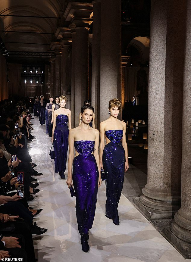 Models walked the runway in purple beaded gowns with cut-out sections