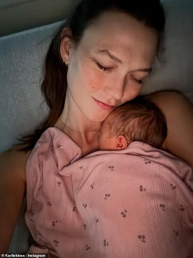 Her daughter - whose name was revealed to be Rae Florence - also rested on her mother's chest in another adorable picture
