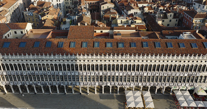 100 large-scale migrant portraits transform venice's iconic procuratie facade